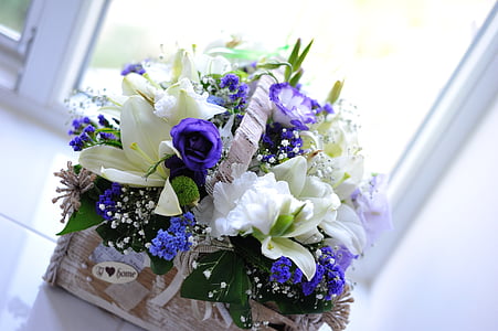 white lilies and purple roses centerpiece
