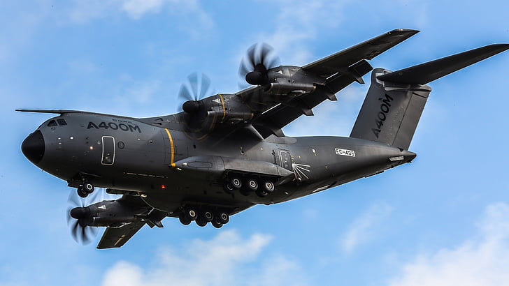 black A400M fighter plane in the sky