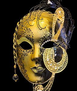 photo of brown and black masquerade mask