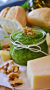 sliced cheese and bread with glass of presto