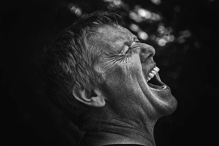 focus photography of growling man