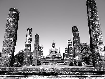 grayscale photograph of Gautama Buddha statue