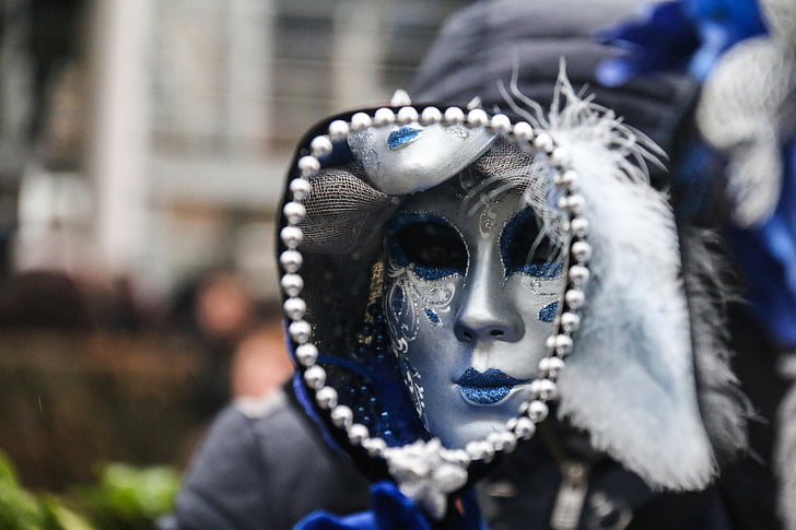 person wearing silver and blue mask