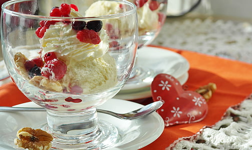 ice cream in glass on plate on table inside room