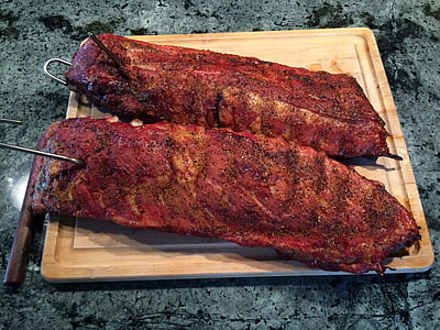 two roasted rib meats on top of cutting board