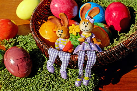 round wicker basket with assorted-color eggs