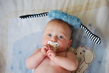 baby with white pacifier
