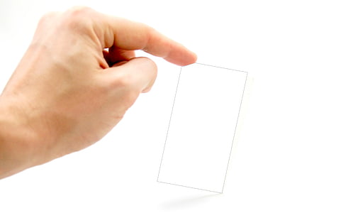 person holding rectangular glass
