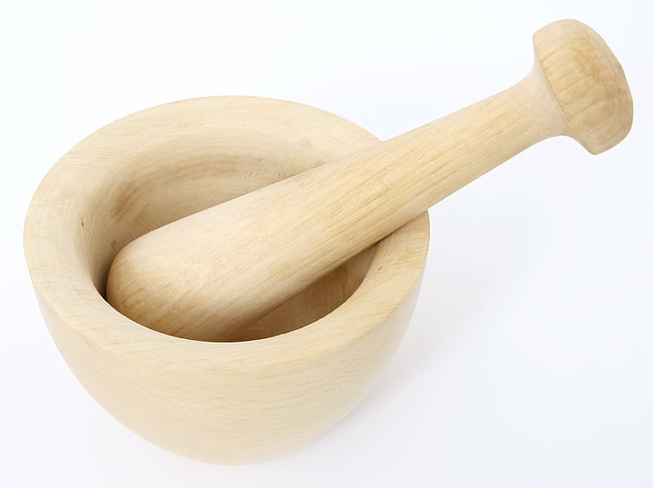 brown wooden mortar and pestle