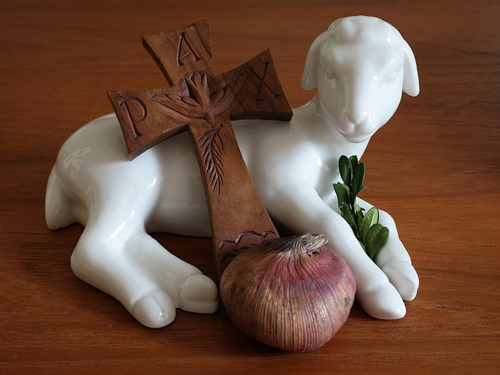 white ceramic goat figurine