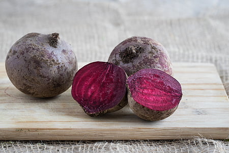 red beets on brown chopping board