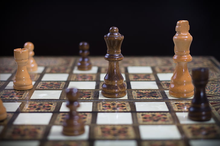 shallow focus photography of Queen chess piece on chess board