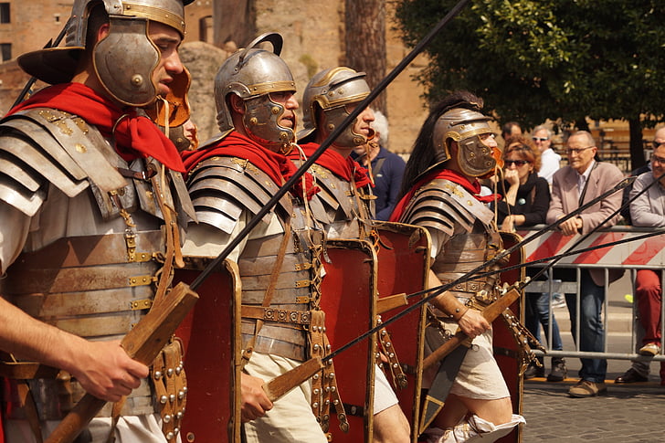 men wearing gray metal armor and spear