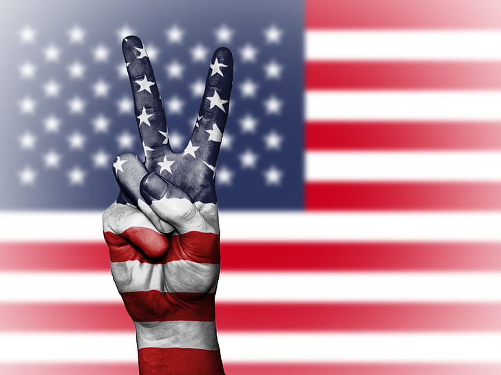 flag of U.S.A and hand peace sign