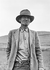 gray scale photo of man in suit jacket