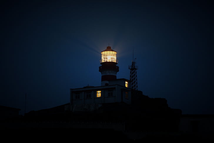 black lighthouse during night