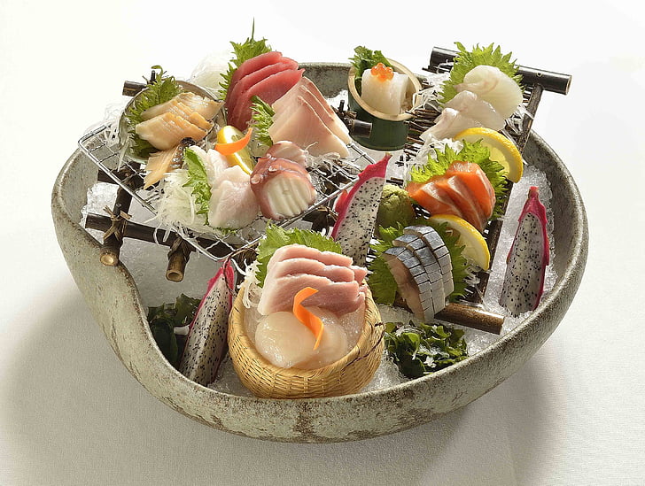 sashimi served on white ceramic pot