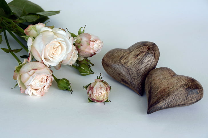 white flowers and brown wooden heart decoration