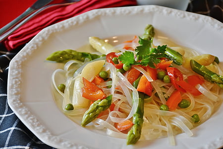vegetable pasta dish in white plate