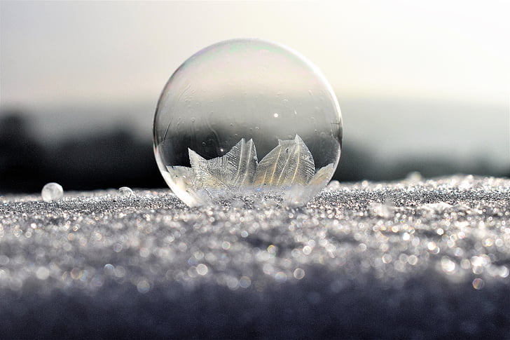 focus photography of clear bubble on ground