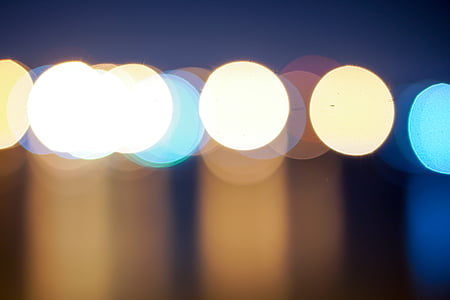 bokeh photography of white, yellow, and blue lights