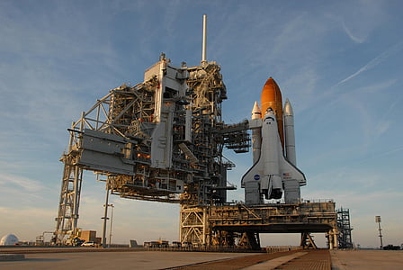 white and orange spaceship during daytime photo
