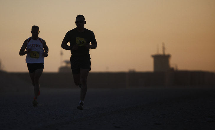 two person jogging photography during sunset