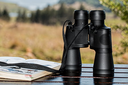 shallow focus photography of black binoculars