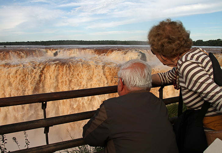 man and woman facing on Niagara Falls at daytime