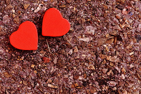 two red heart decors on ground