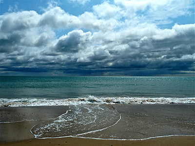 seashore under columbus clouds