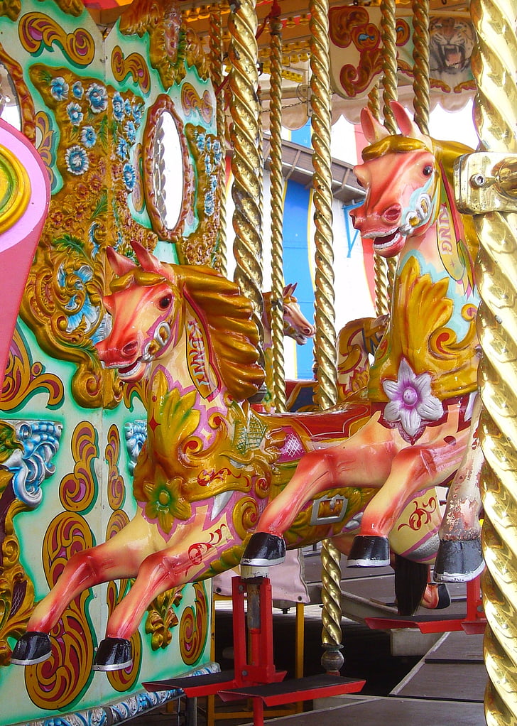 pink and yellow horse carousel