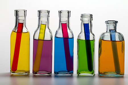 five clear glass bottles