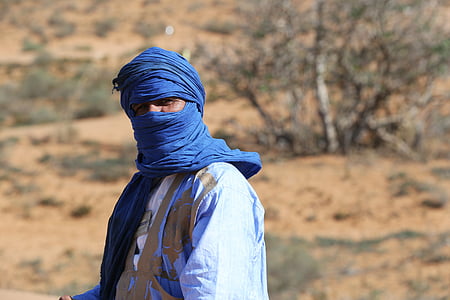 macro photography of man in blue hijab