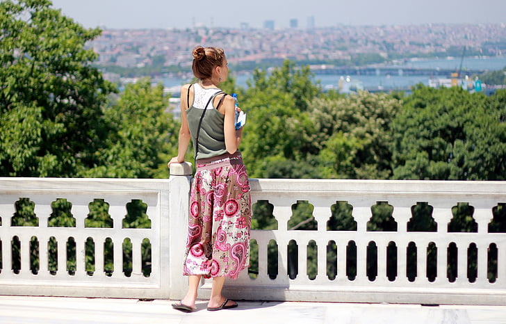 woman standing near railings during daytime