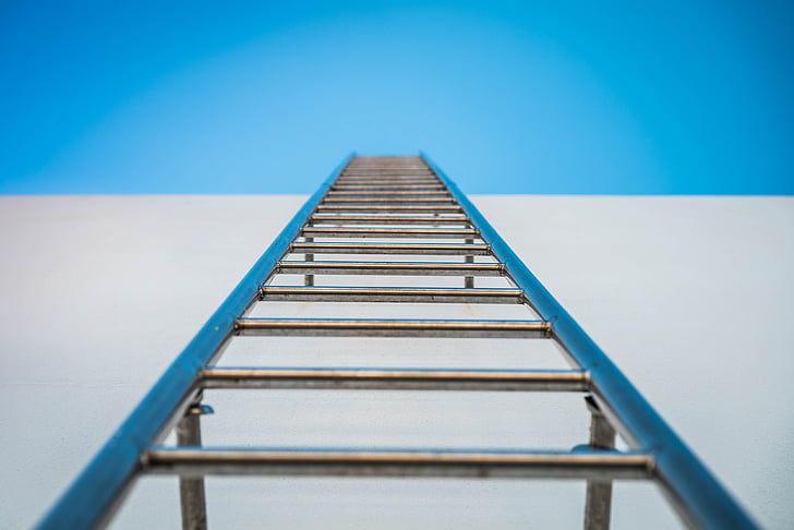 low angle photography of silver ladder
