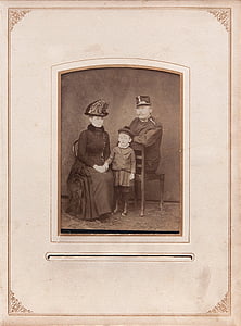 man and woman with child photo