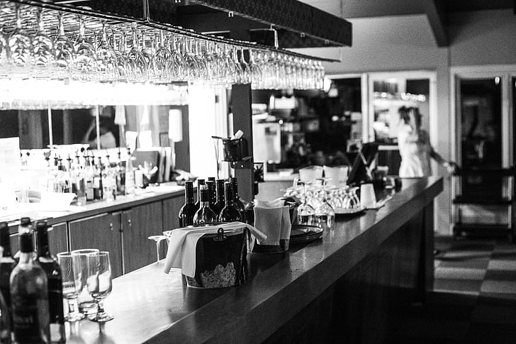 grayscale photography of bar counter