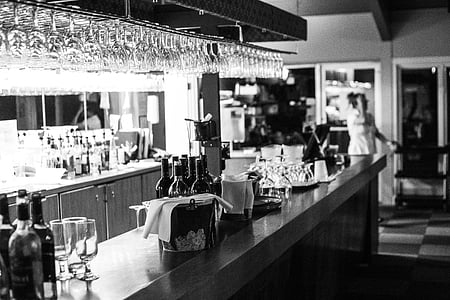grayscale photography of bar counter