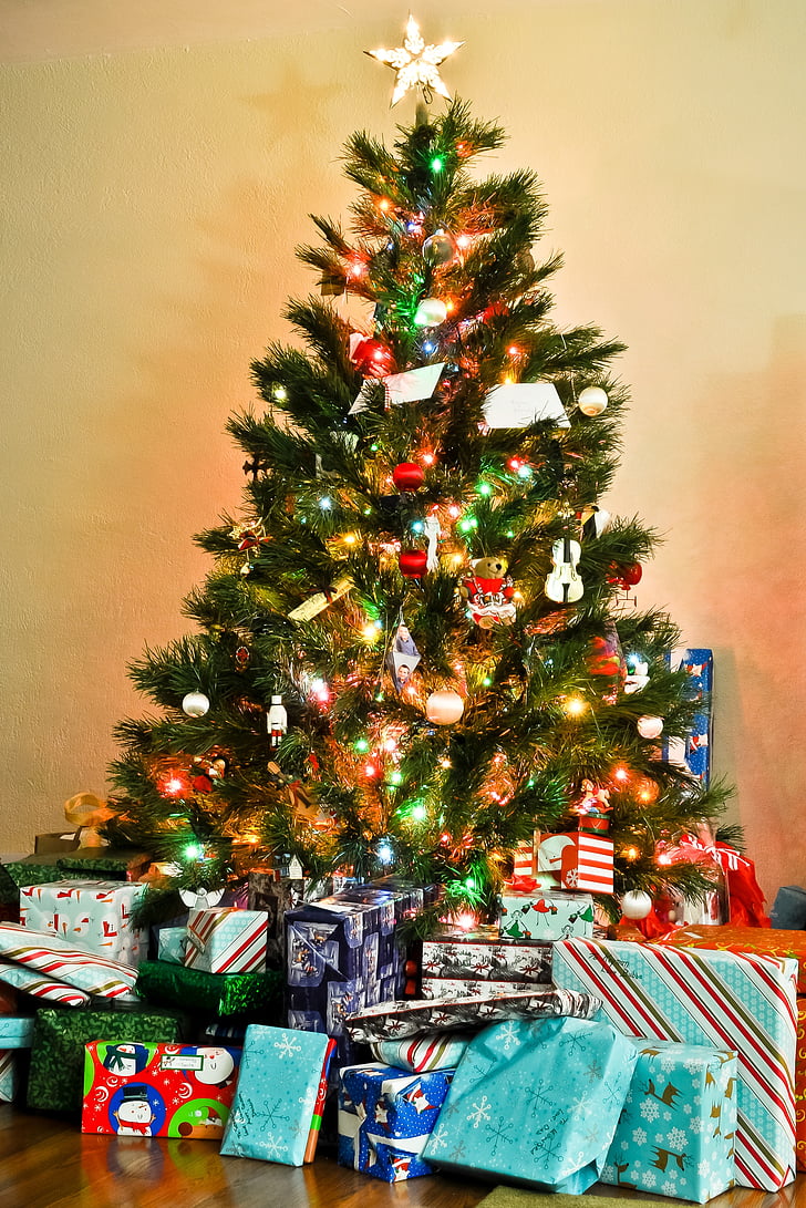 lighted christmas tree with gifts