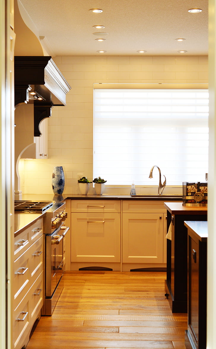 white wooden kitchen cabinet behind white painted wall