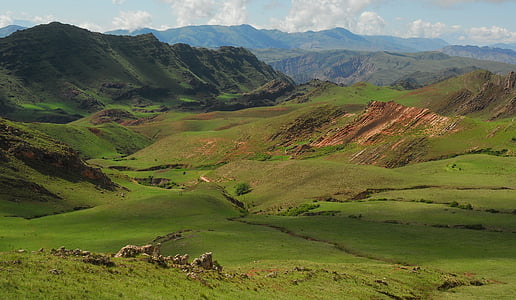 landscape photography of hill at daytime