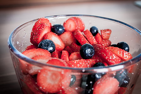 sliced strawberries in bowl