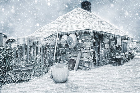 drum beside snow covered house