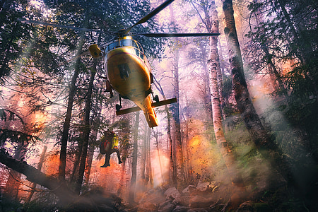 yellow helicopter dropping person at forest digital wallpaper