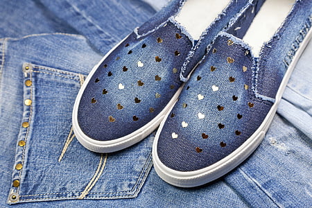 pair of white-and-blue denim slip-on shoes