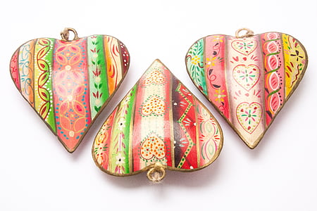 three multicolored heart pendants