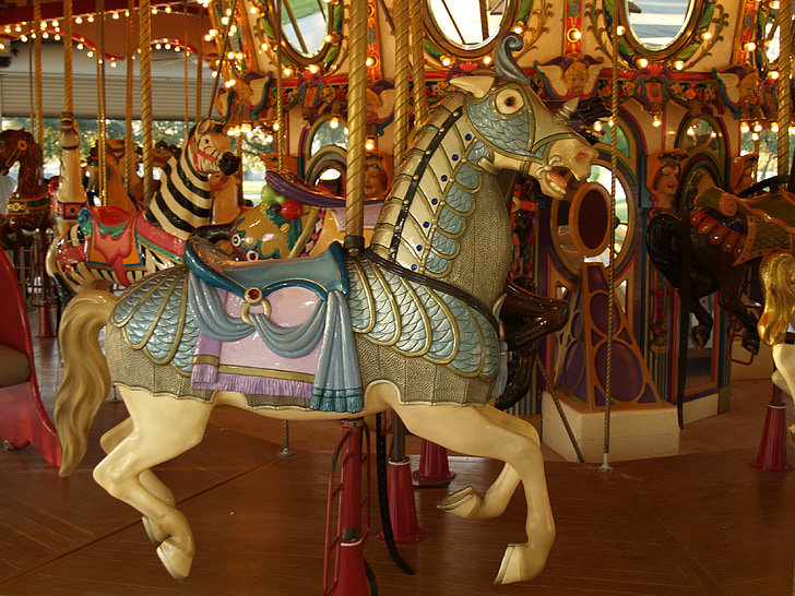 photo of beige and green horse carousel