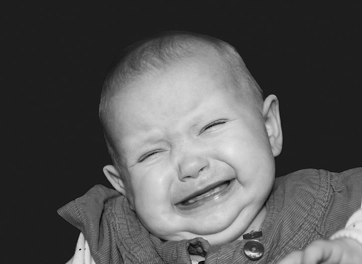 crying baby on grayscale photography