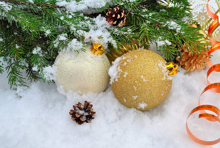 two Christmas bauble surrounding with snow